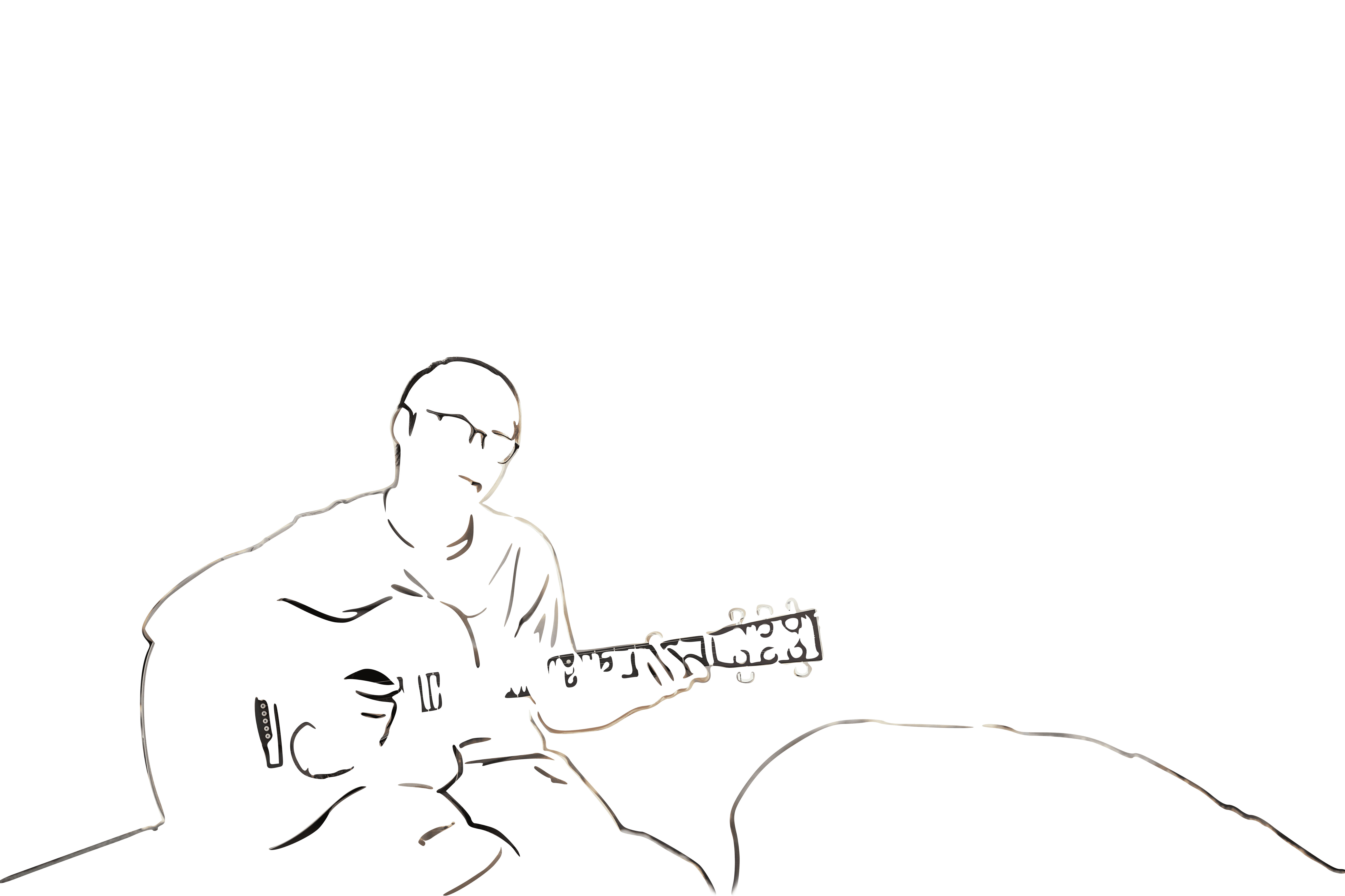 A musician playing the guitar on a rocky beach